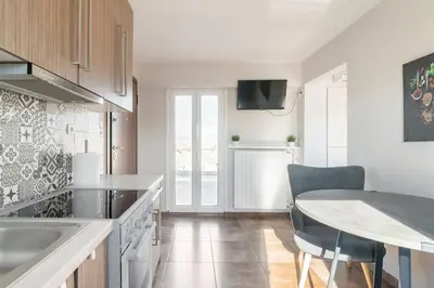 a kitchen with a table and a dining room at Acropolis from my bed in Athens