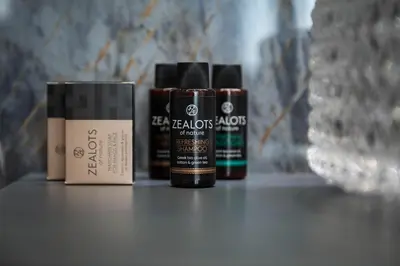 three bottles of hair products sitting on a counter at Athens Feeling in Athens
