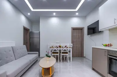 a living room with a couch and a table at Renovated 2BD house close to Pireus port in Piraeus