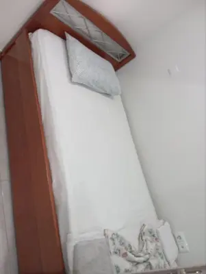 a close up of a bed with a mirror at Renovated 2BD house close to Pireus port in Piraeus