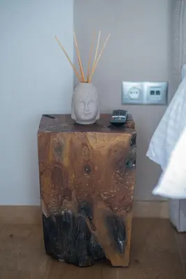 a wooden table with a vase on top of it at Palmyra Athens in Athens