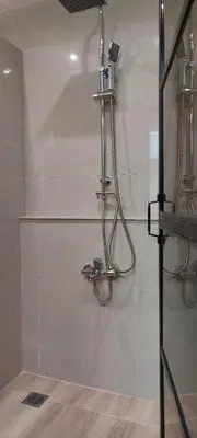 a shower in a bathroom with a glass door at Deluxe Apartment 12BD 6BATH in Athens