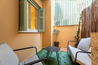 a small room with two chairs and a table at Elegant 2 Bedroom Apartment - near National Museum in Athens