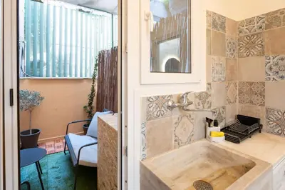 a bathroom with a wooden sink in a room at Elegant 2 Bedroom Apartment - near National Museum in Athens