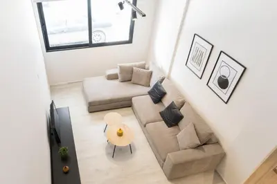 a living room with a couch and a table at Voda Luxury Residence #002 - Acropolis View Rooftop in Athens