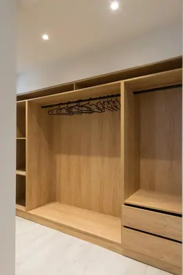 a walk in closet with wooden cabinets at Voda Luxury Residence #002 - Acropolis View Rooftop in Athens