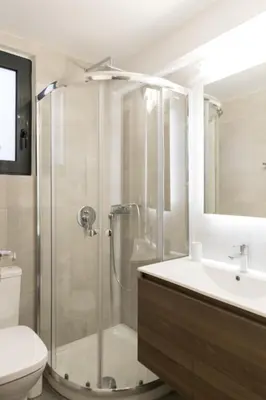 a bathroom with a shower and a toilet and a sink at Voda Luxury Residence #002 - Acropolis View Rooftop in Athens