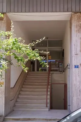 a staircase leading up to a building with a stair case at A Sunkissed retreat under the Acropolis in Athens