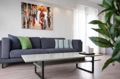 a living room with a couch and a coffee table at Acropolis Area Large 3BR 2BA Apartment in Athens