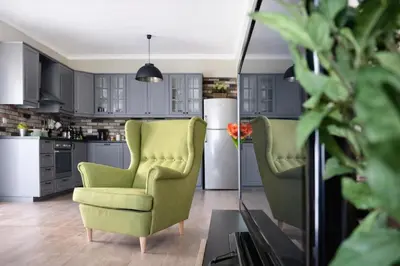 a kitchen with two chairs and a refrigerator at Acropolis Area Large 3BR 2BA Apartment in Athens