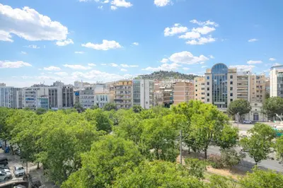 a cityscape of a city with trees and buildings at Acropolis Area Large 3BR 2BA Apartment in Athens