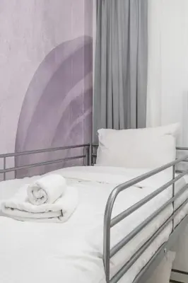 a bedroom with two beds with white towels on them at Lux 2 bedroom apt next to metro in Athens