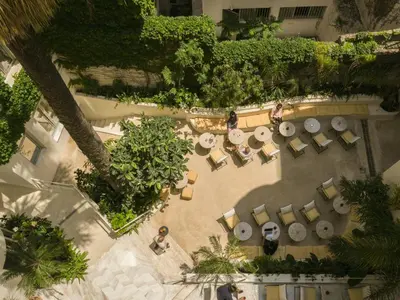 an overhead view of a garden with tables and chairs at Apollo Palm Hotel in Athens