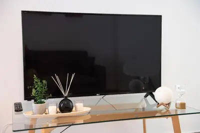 a large flat screen tv sitting on top of a glass table at City view modern apartment (D3_FAL) in Athens