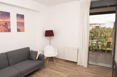 a living room with a couch and a balcony at City view modern apartment (D3_FAL) in Athens