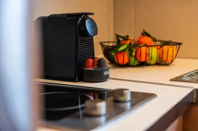 a microwave sitting on top of a kitchen counter at AlMar- Διαμέρισμα στο κέντρο της Ηλιούπολης in Athens