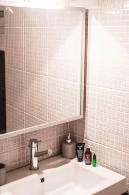 a bathroom with a sink and a mirror at AlMar- Διαμέρισμα στο κέντρο της Ηλιούπολης in Athens