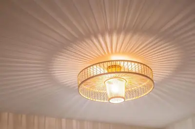 a light fixture hanging from the ceiling of a room at AlMar- Διαμέρισμα στο κέντρο της Ηλιούπολης in Athens