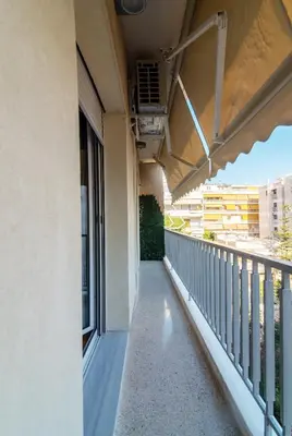 a balcony of a building with a view of the street at Luxury 1-Bedroom Apartment by the Sea in Athens in Athens
