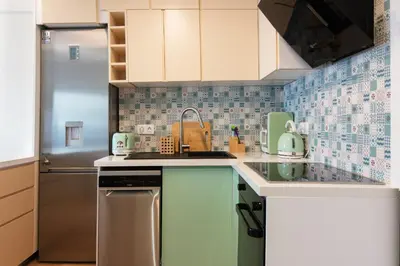 a kitchen with a sink and a dishwasher at Luxury 1-Bedroom Apartment by the Sea in Athens in Athens