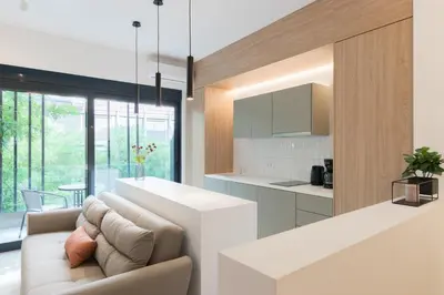 a kitchen and living room with a couch and a table at Voda Luxury Residence #101 - Acropolis View Rooftop in Athens