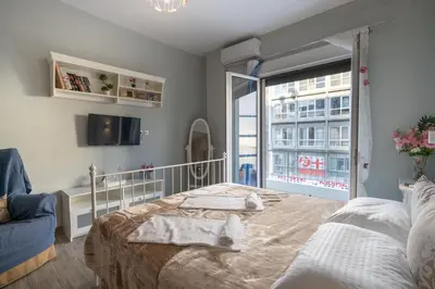 a bedroom with a bed and a large window at Athens center 2 persons flat by MPS in Athens
