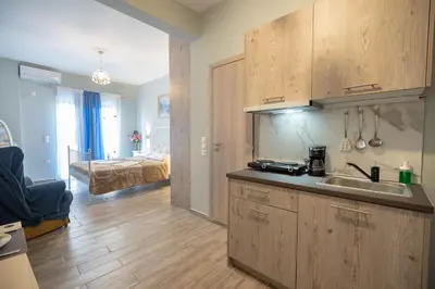 a kitchen with a sink and a room with a bed at Athens center 2 persons flat by MPS in Athens