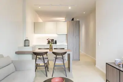 a kitchen and living room with a table and chairs at Voda Luxury Residence #102 - Acropolis View Rooftop in Athens