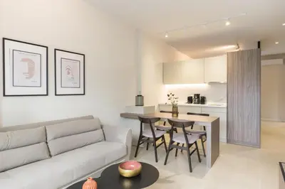 a living room with a couch and a table at Voda Luxury Residence #102 - Acropolis View Rooftop in Athens