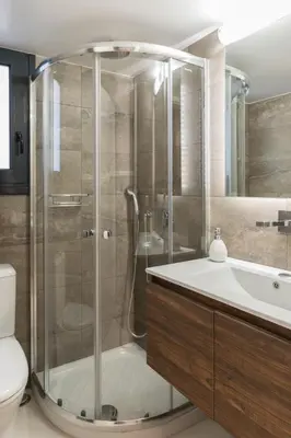 a bathroom with a shower and a sink at Voda Luxury Residence #102 - Acropolis View Rooftop in Athens