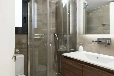 a bathroom with a shower and a sink at Voda Luxury Residence #102 - Acropolis View Rooftop in Athens