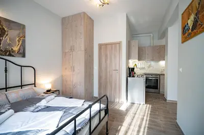 a bedroom with a bed and a kitchen at Athens center 1 bedrm 4 pers apartment by MPS in Athens