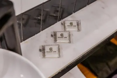 a white counter with four signs on it at SoHo Athinas 60 in Athens