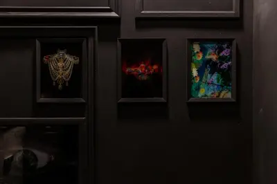 a door with three paintings on it at SoHo Athinas 60 in Athens