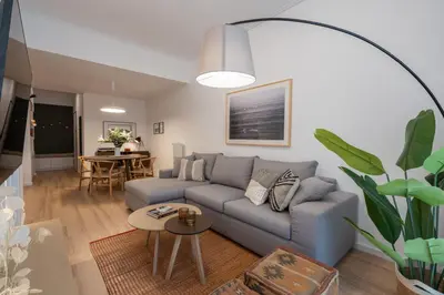 a living room with a couch and a table at Unique 2 Bedrooms Apartment, Steps to Plaka and City center in Athens