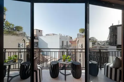 a balcony with a view of a city at Clyde Athens by Nin&Bau in Athens