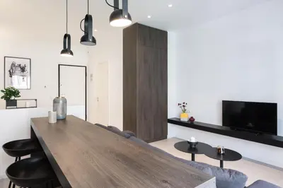 a living room with a large wooden table and chairs at Voda Luxury Residence #201 - Acropolis View Rooftop in Athens