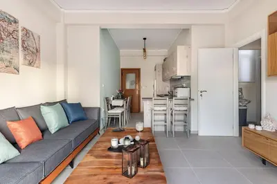 a living room with a couch and a table at Acropolis View in Athens