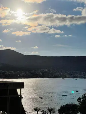 a view of a lake with boats in the water at Blanco Apartment by A&D Properties in Porto Rafti