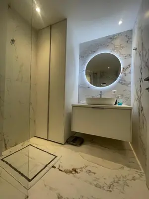 a bathroom with a sink and a mirror at PAGRATI FLAT 7 in Athens