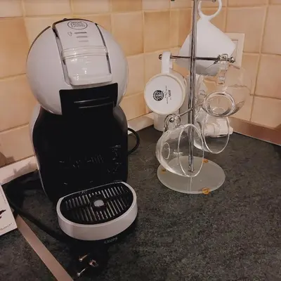 a black and white mixer sitting on top of a counter at Elpida's house in Spáta