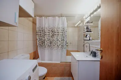 a bathroom with a shower with a toilet and a sink at Cozy & Relaxing Apartments-Agia Paraskevi in Athens