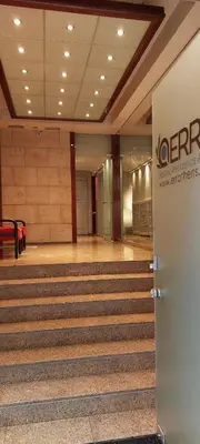 an empty lobby with stairs in a building at Luxury Apartment 12BD 5BATH in Athens