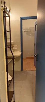 a bathroom with a shower and a toilet and a sink at Luxury Apartment 12BD 5BATH in Athens