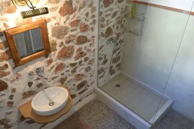 a bathroom with a shower and a toilet and a sink at SUNNY QUIET APATMENT AT LYCABETOUS in Athens