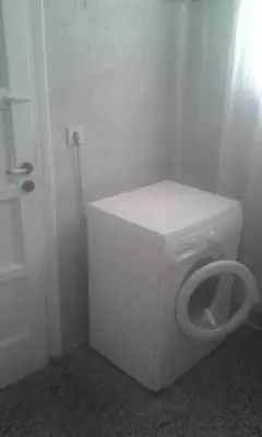 a bathroom with a white toilet in a room at SUNNY QUIET APATMENT AT LYCABETOUS in Athens