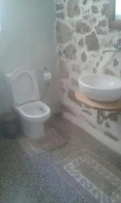 a bathroom with a white toilet and a sink at SUNNY QUIET APATMENT AT LYCABETOUS in Athens