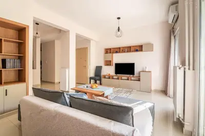 a living room with a couch and a table at Athens Innova Apartment I in Athens