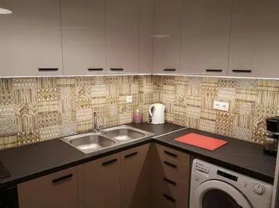 a kitchen with a sink and a washing machine at Athens Innova Apartment I in Athens