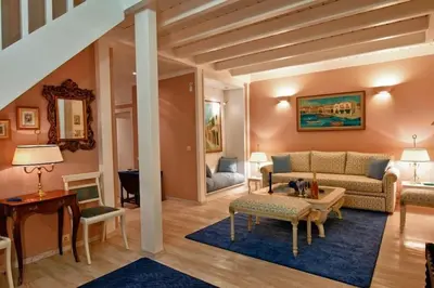 a living room with a couch and a table at Acropolis Luxury House in Athens